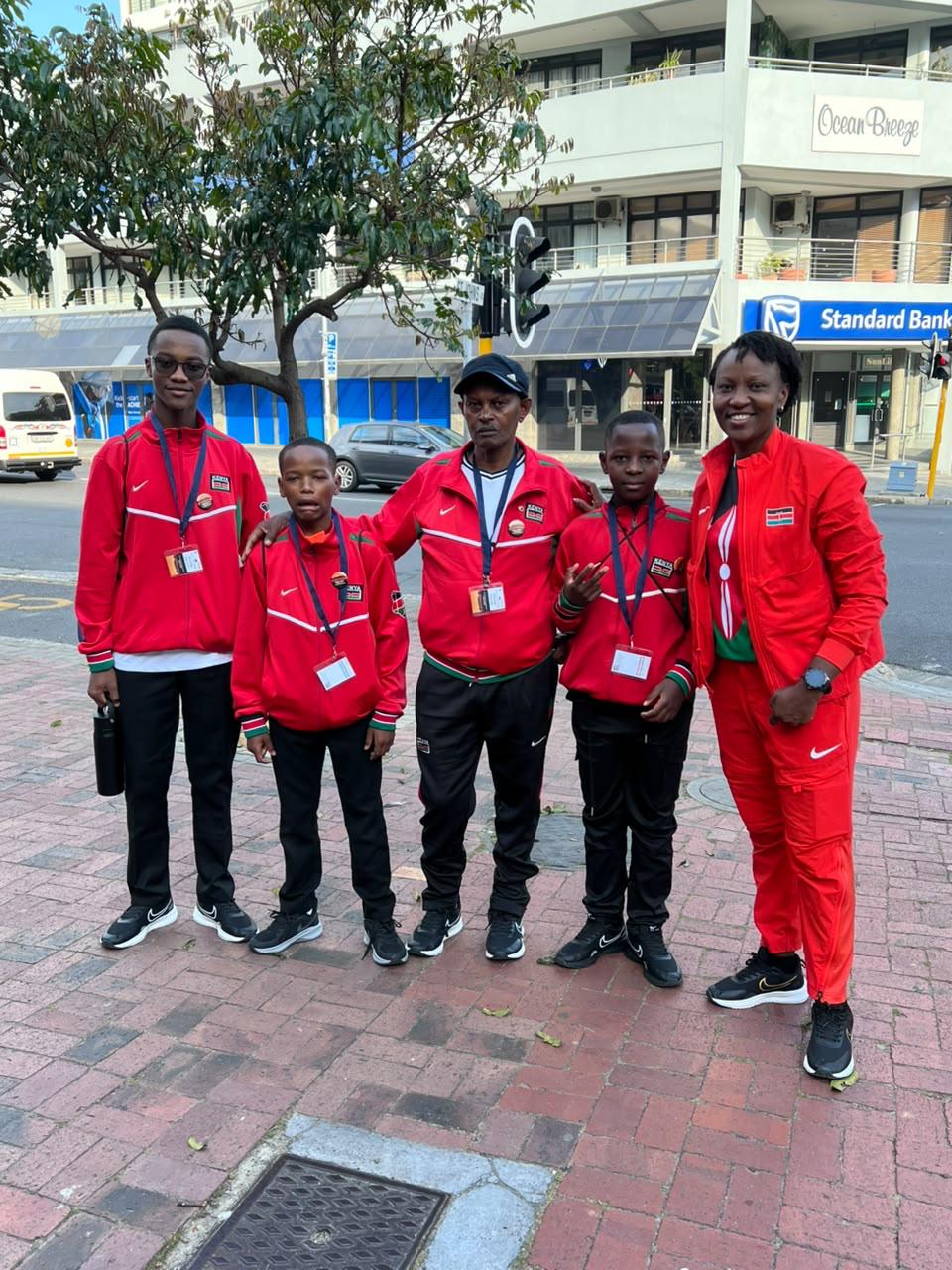 Kenya team members in red tracksuits outside Camps Bay High School