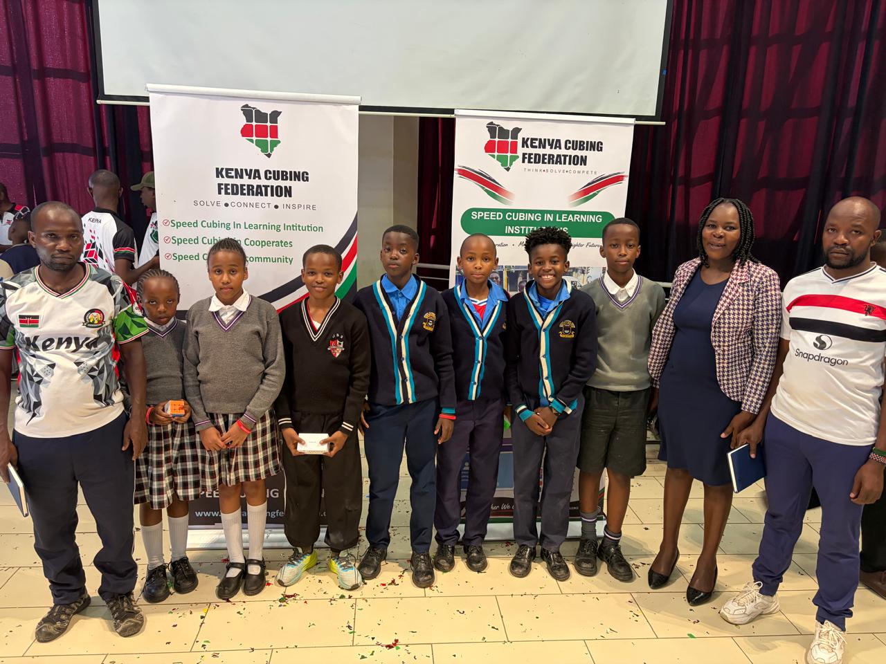 Kenya Cubing Federation members standing together at an indoor event